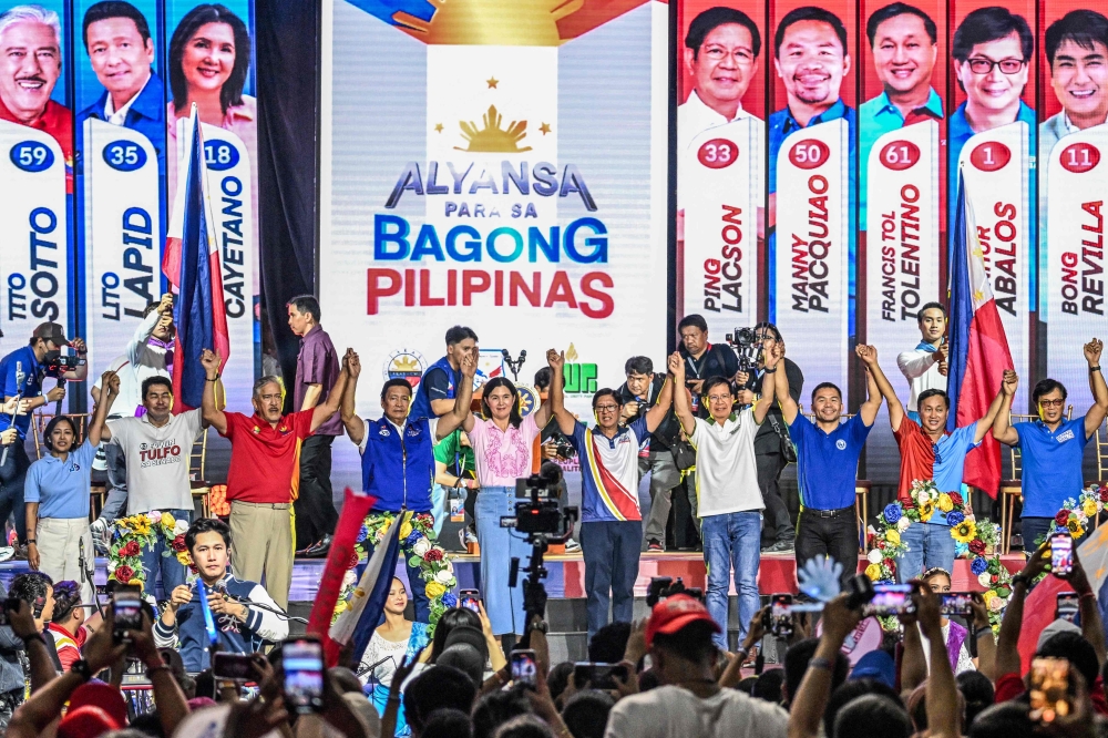 Philippines’ President Ferdinand Marcos Jr (centre) attends a campaign rally of senatorial candidates under his party in Mandaluyong, Metro Manila, on May 9, 2025, ahead of the midterm elections. — AFP pic 
