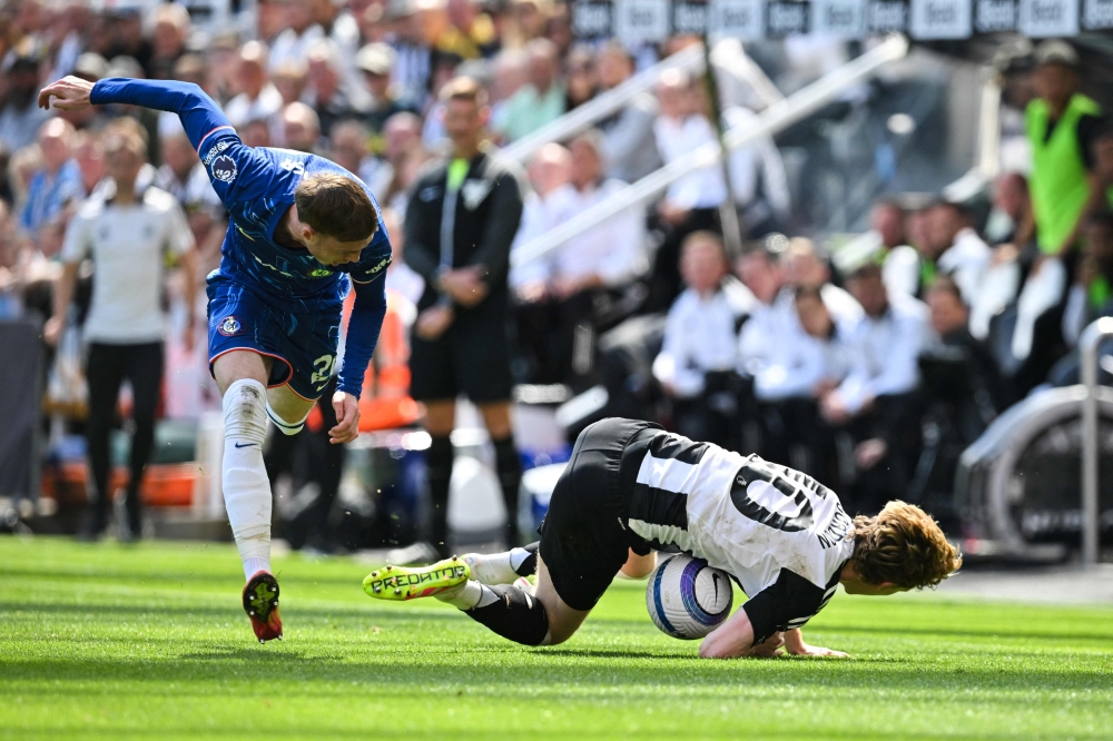 Chelsea’s English midfielder Cole Palmer (left) tackles Newcastle United’s English midfielder Anthony Gordon as they fight for the ball during the English Premier League football match between Newcastle United and Chelsea at St James’ Park in Newcastle-upon-Tyne, north-east England on May 11, 2025. — AFP pic 