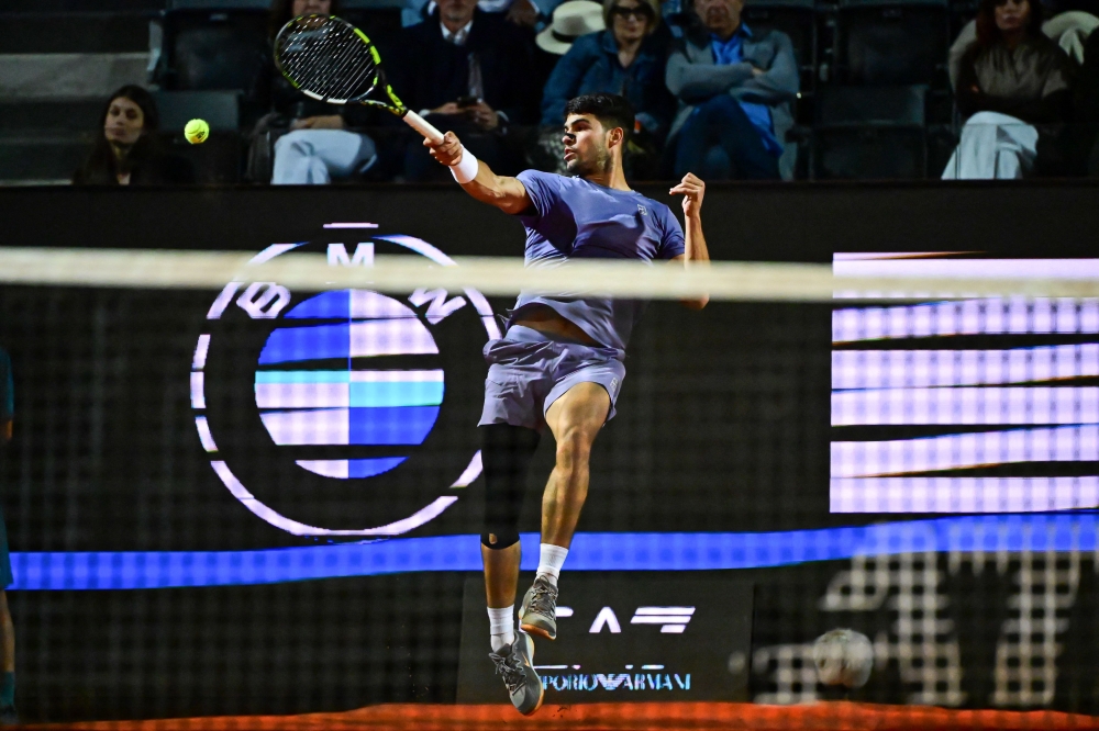 Spain’s Carlos Alcaraz returns a shot to Serbia’s Laslo Djere during their men’s singles match for the ATP Rome Open tennis tournament at Foro Italico in Rome on May 11, 2025. — AFP pic 