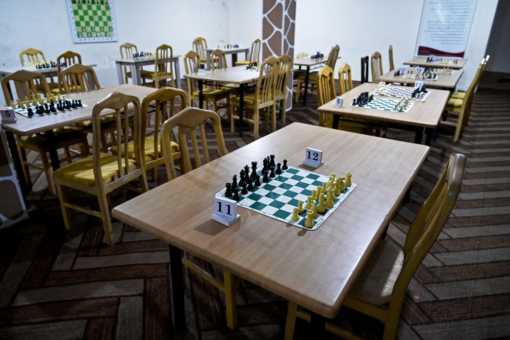 Chessboards are kept in an empty hall with no players at the Kabul Elite Chess Club in Kabul on May 11, 2025. Taliban authorities have barred chess across Afghanistan until further notice over concerns it is a source of gambling, which is illegal under the government’s morality law, a sports official said on May 11. — AFP pic 