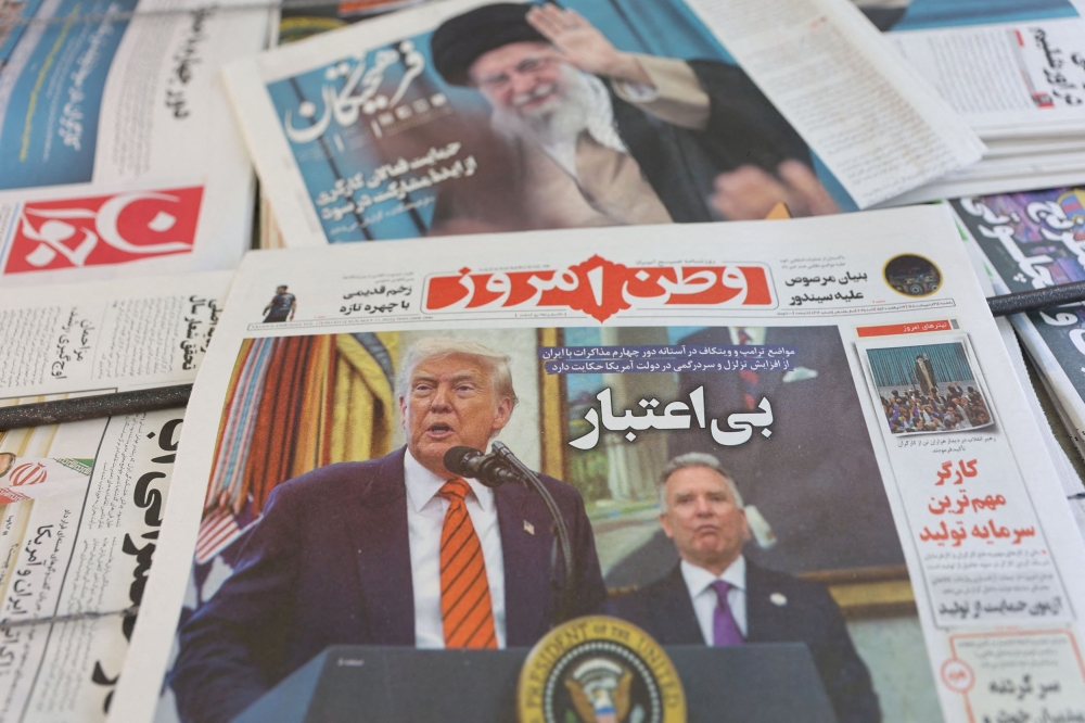 An Iranian newspaper with a cover photo of US President Donald Trump and US Middle East envoy Steve Witkoff, is seen in Tehran, Iran, May 11, 2025. — Majid Asgaripour/WANA (West Asia News Agency) handout pic via Reuters  