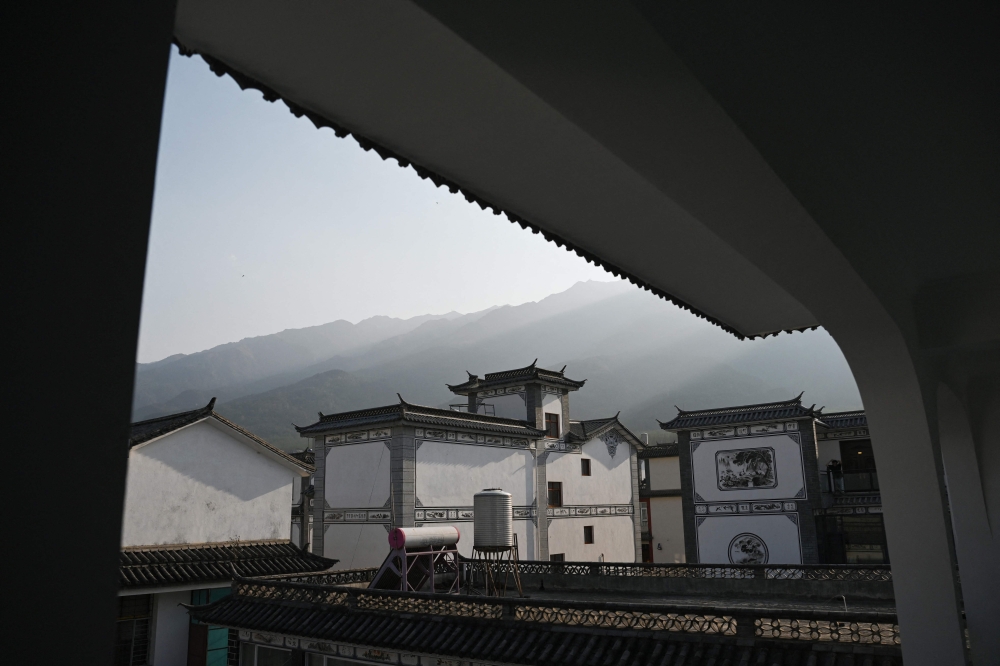 This photo taken on April 2 shows the Cangshan mountains as seen from the Seventeen Youth Retirement Home, a hostel catering to young people who stay and socialise together for weeks or months, in Dali, in China's southwestern Yunnan province. — AFP pic