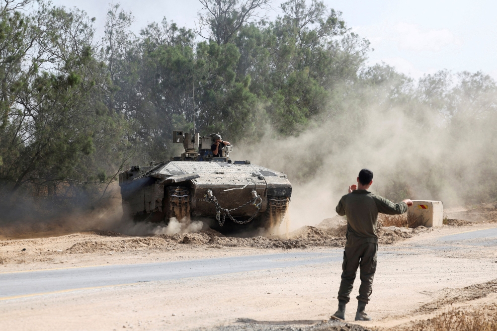 An Israeli armoured personnel carrier (APC) operates near the Israel-Gaza border, amid the ongoing conflict between Israel and Hamas, in Israel, May 19, 2025. — Reuters pic