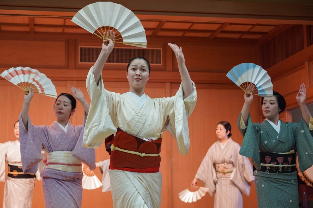 This photo taken on May 8, 2025 shows Shinbashi geishas rehearsing under the watchful eyes of instructors before the 100th edition of the Azuma Odori at the Shinbashi Enbujo Theatre in Tokyo. — AFP pic