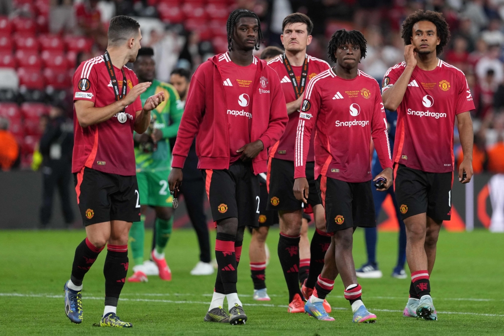 Manchester United players react after the Uefa Europa League final football match between Tottenham Hotspur and Manchester United at San Mames stadium in Bilbao May 21, 2025. — AFP pic