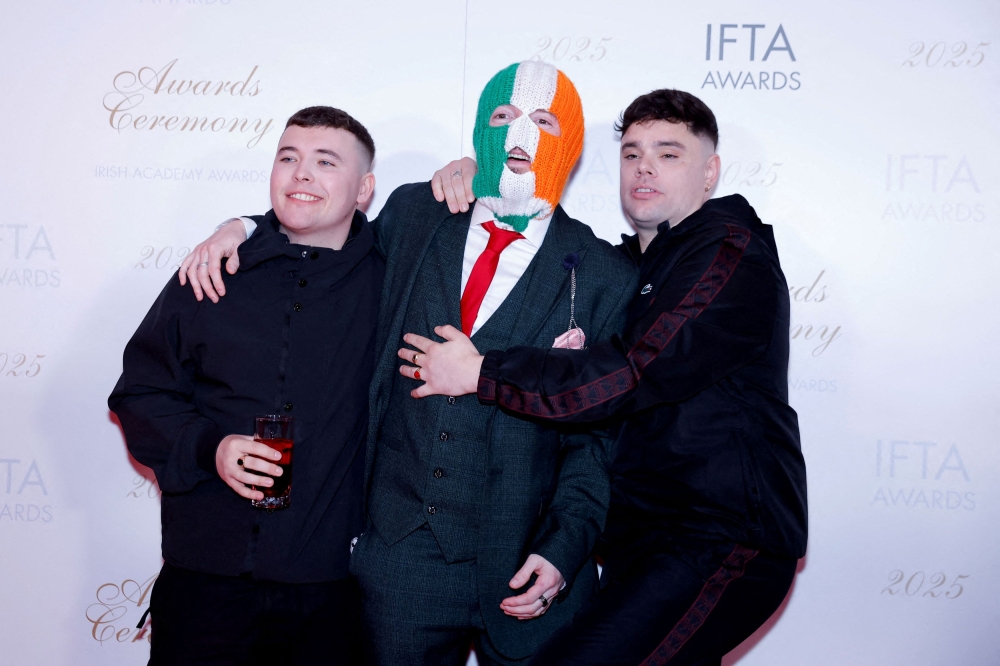 Members of Kneecap pose on the red carpet at the Irish Film and Television Academy (IFTA) Awards in Dublin February 14, 2025. — Reuters pic
