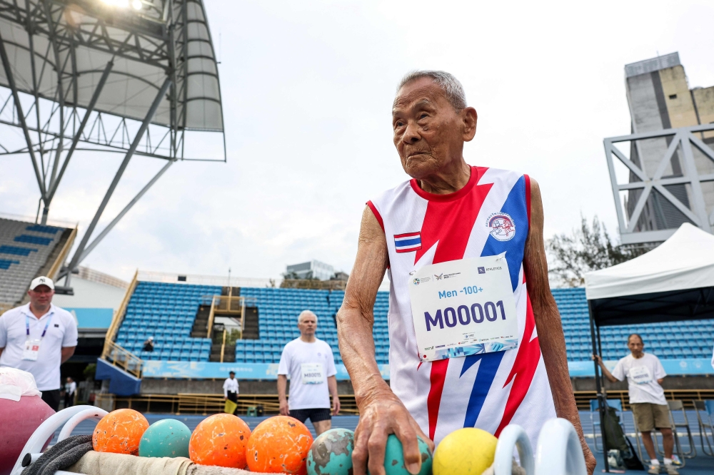 Thailand's Sawang Janpram, the oldest competitor at the 2025 World Masters Games at 105 years old, gets ready for the shot put competition at Taipei Municipal Stadium during the World Master Games 2025 in Taipei on May 22, 2025. Sawang is unrivalled at the World Masters Games underway in Taiwan where he ranks as the oldest competitor and the only person in his age group. — AFP pic