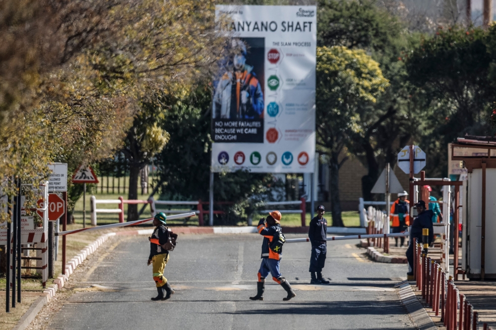Some of the resurfaced 260 employees stuck underground leave the South Africa's Sibanye Stillwater's Kloof 7 sub-shaft in Westonaria on May 23, 2025. — AFP pic