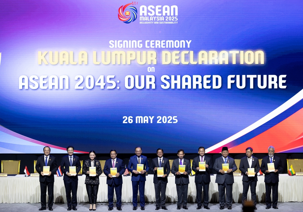 Asean leaders pose for a group photo during signing ceremony of the Kuala Lumpur Declaration on Asean 2045: Our Shared Future at the Kuala Lumpur Convention Centre May 26, 2025. — Picture by Firdaus Latif