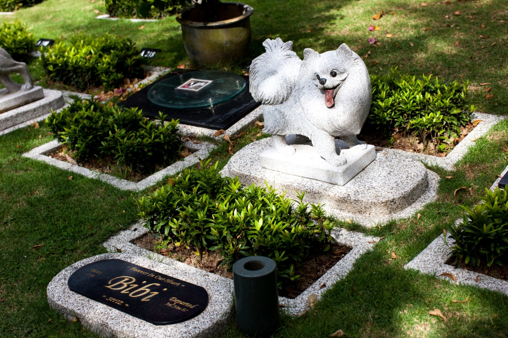 A headstone carved in the likeness of one’s beloved animal companion at the Pet Memorial Garden in Nirvana Memorial Park, Semenyih. — Picture courtesy of Nirvana Asia