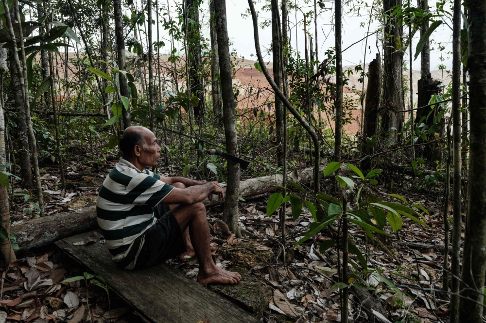 Ngigoro, 62, an elder of the Hongana Manyawa indigenous tribe who left the forest and now lives in a village with his mother. — AFP pic