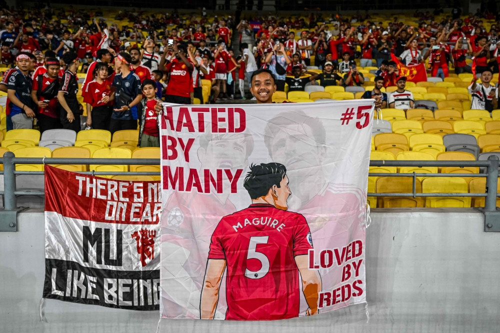 Fans cheer before the exhibition friendly football match between Manchester United and ASEAN All-Stars at the National Stadium Bukit Jalil in Kuala Lumpur on May 28, 2025. — AFP pic