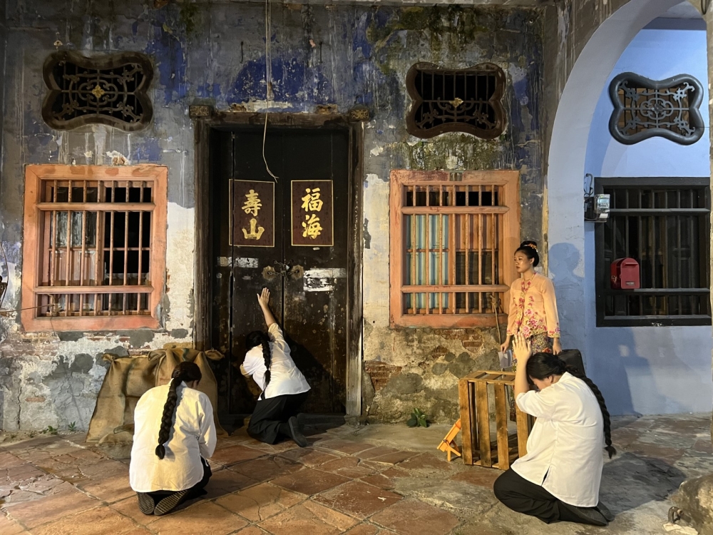 The second scene depicting girls being sent away in early 20th-century China due to poverty, often in arranged marriages to men decades older than them. — Picture by Opalyn Mok