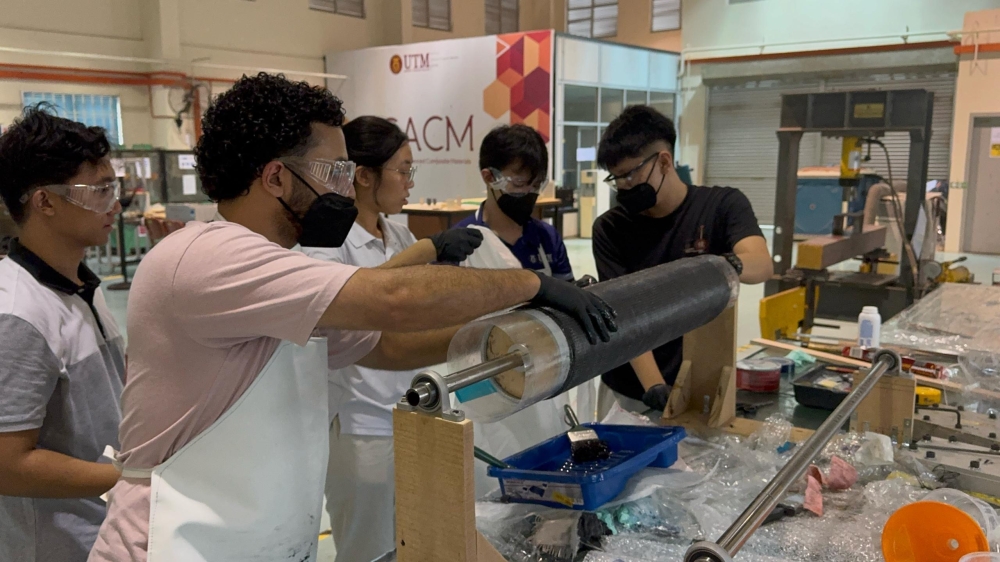 UTM Rocketry Team members preparing the Rimau-1 rocket’s structure with composite material and epoxy in the early stages of the project in 2024. — Picture courtesy of UTM Rocketry Team