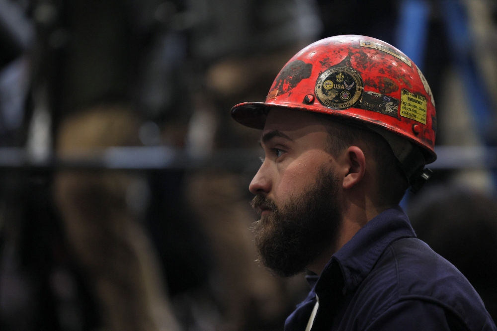 Steel worker Hunter Piper listens as US President Donald Trump delivers remarks at U.S. Steel Corporation-Irvin Works in West Mifflin, Pennsylvania May 30, 2025. — Reuters pic