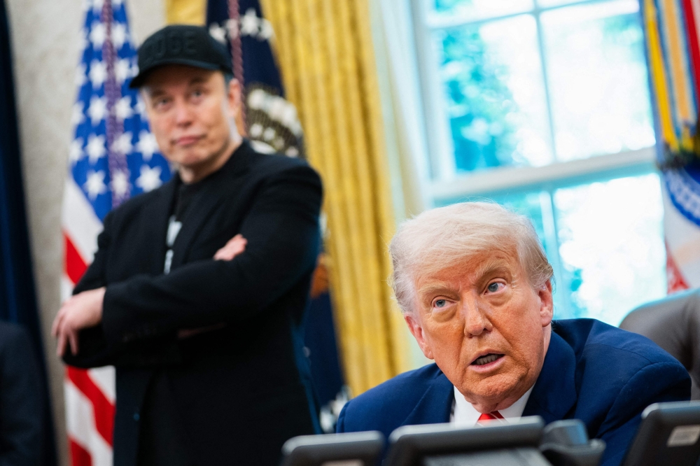 US President Donald Trump speaks during a news conference with Elon Musk (L) in the Oval Office of the White House in Washington, DC May 30, 2025. — AFP pic