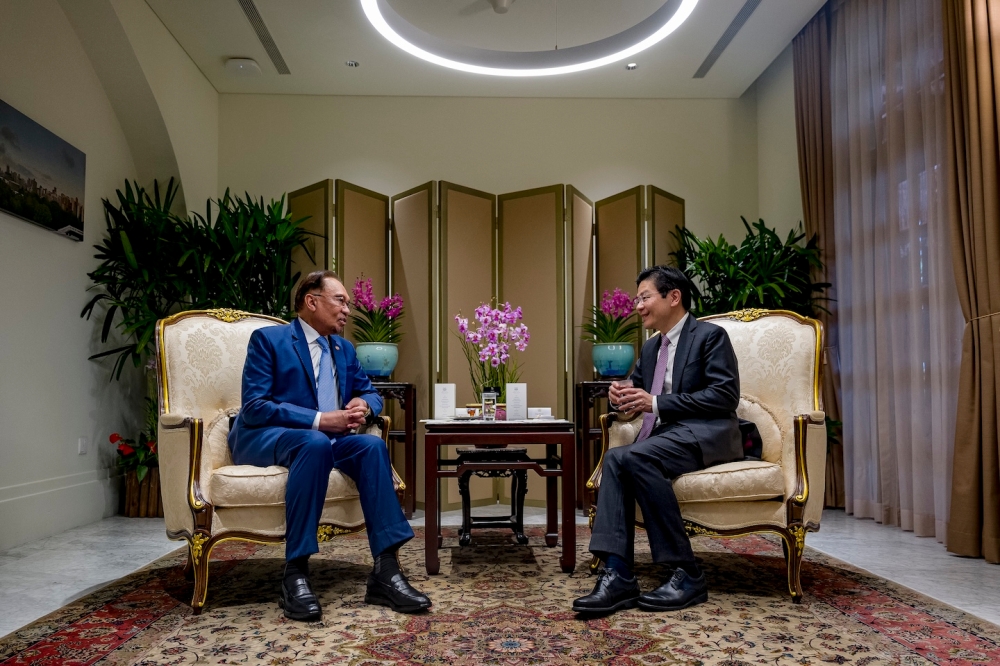 Prime Minister Datuk Seri Anwar Ibrahim in a bilateral meeting his Singaporean counterpart Lawrence Wong. — Picture from Prime Minister's Office