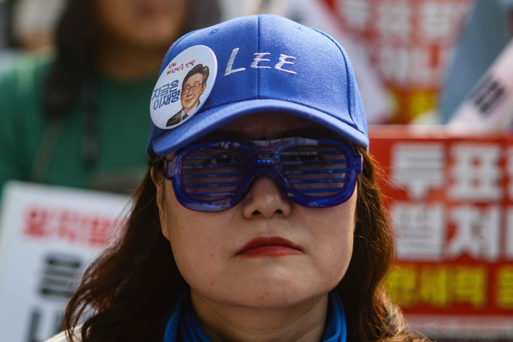 A supporter of Lee Jae-myung of the liberal Democratic Party attends a rally ahead of the upcoming June 3 presidential election. — AFP pic