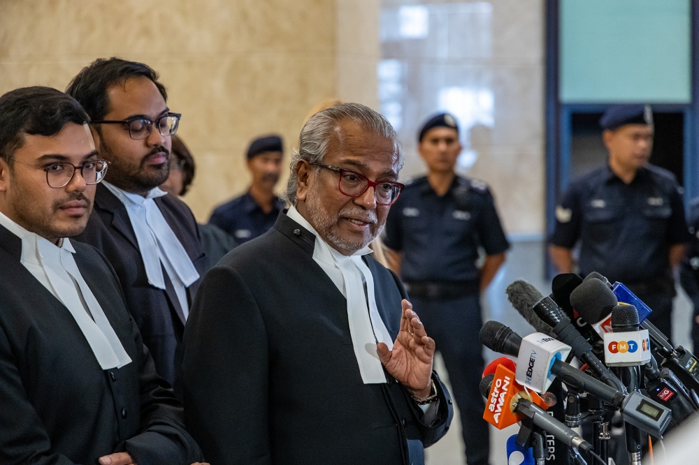 Lawyer Tan Sri Muhammad Shafee Abdullah speaks during a press conference at the Palace of Justice in Putrajaya on January 6, 2025. — Picture by Firdaus Latif