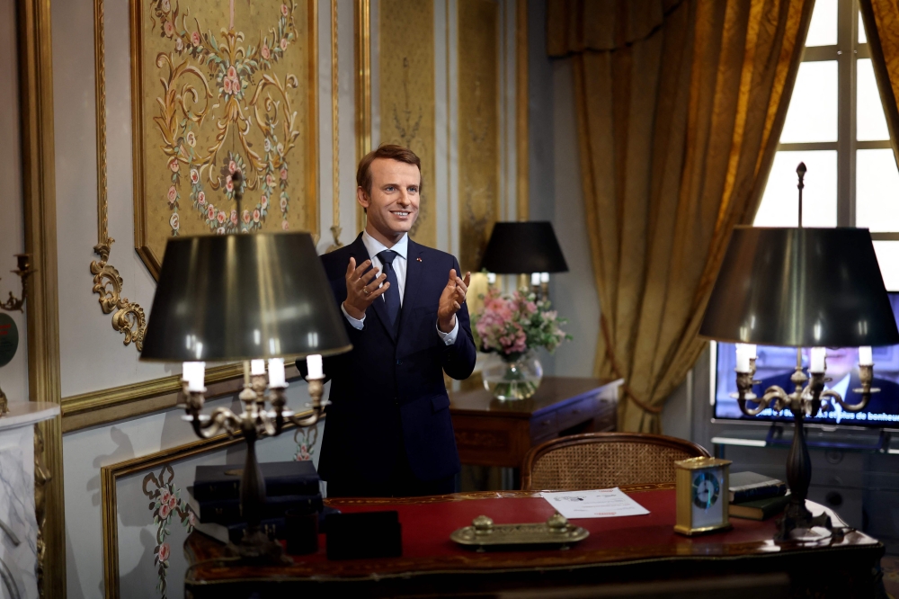 A wax statue of French President Emmanuel Macron is seen at the Musee Grevin in Paris on June 2, 2022. — AFP pic