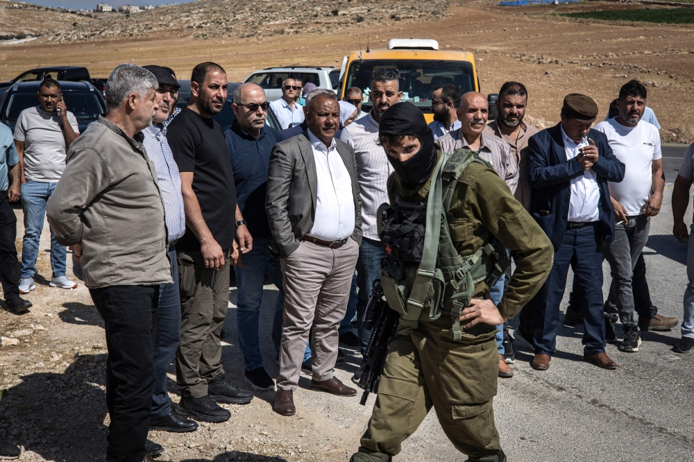 Israeli security forces block a Palestinian Authority delegation from entering the village of al-Tuwani in the Masafer Yatta area in Occupied West Bank on June 2, 2025. — AFP pic