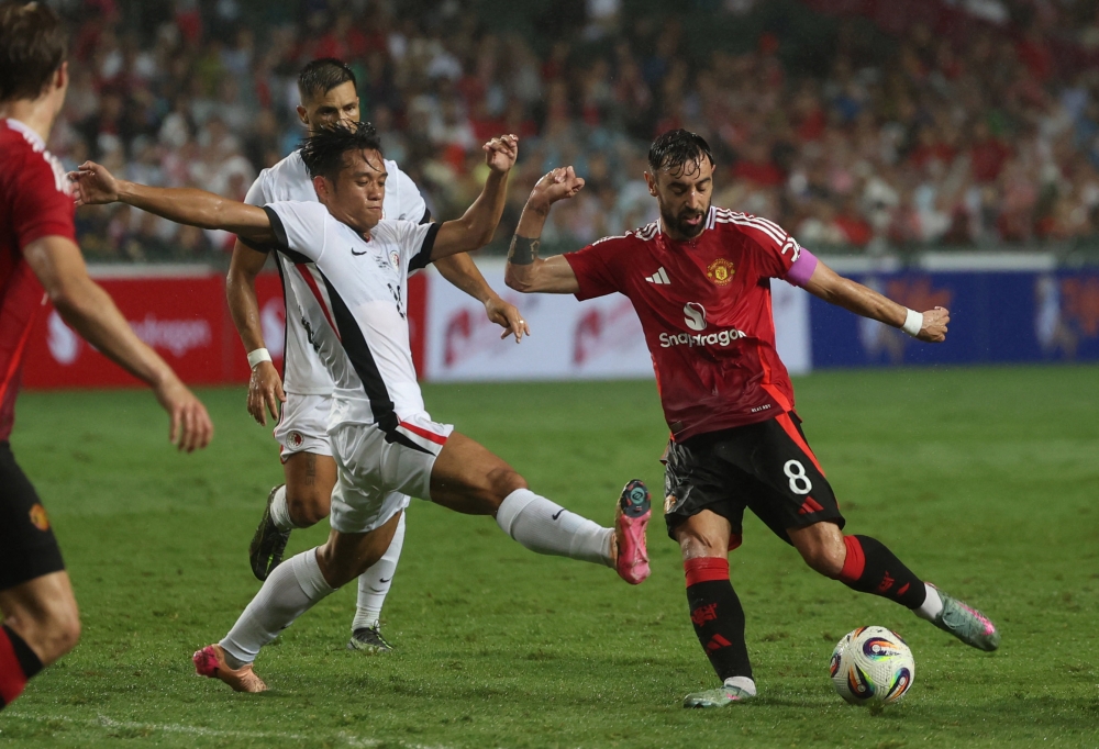 Manchester United’s Bruno Fernandes in action with Hong Kong’s Cheuk-Pan Ngan at Hong Kong Stadium, Hong Kong, May 30, 2025. — Reuters pic