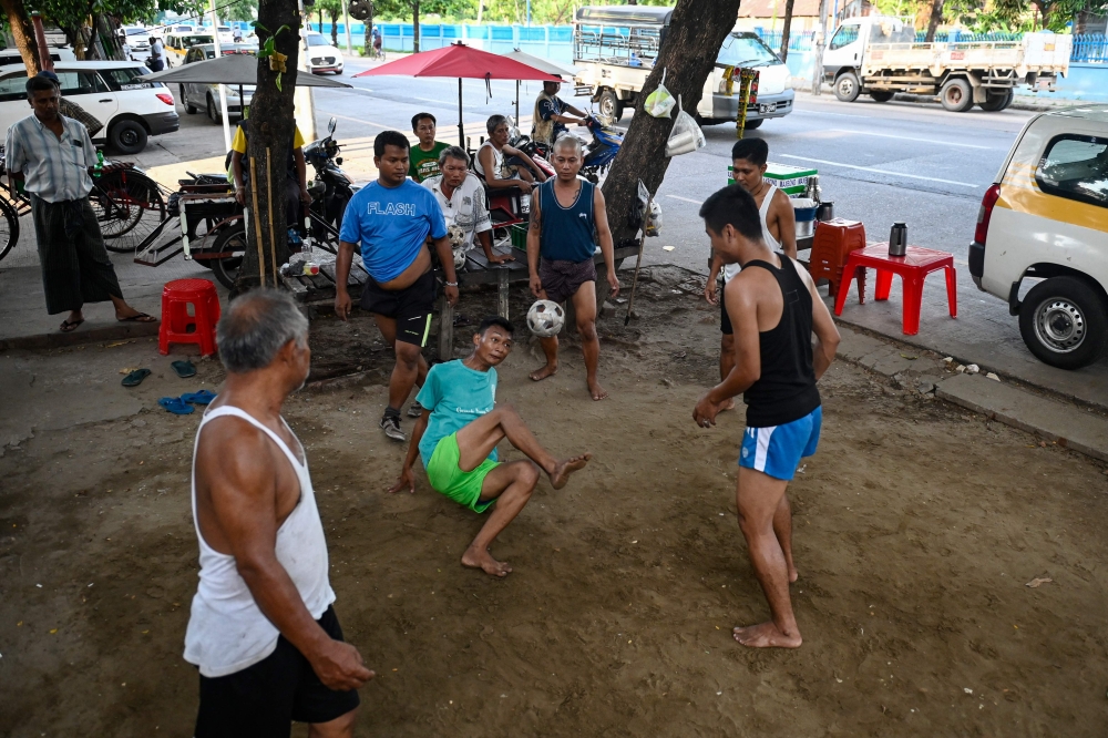 Mastering control of the rising and falling rattan chinlone ball teaches patience, says a veteran of the traditional Myanmar sport. — AFP pic