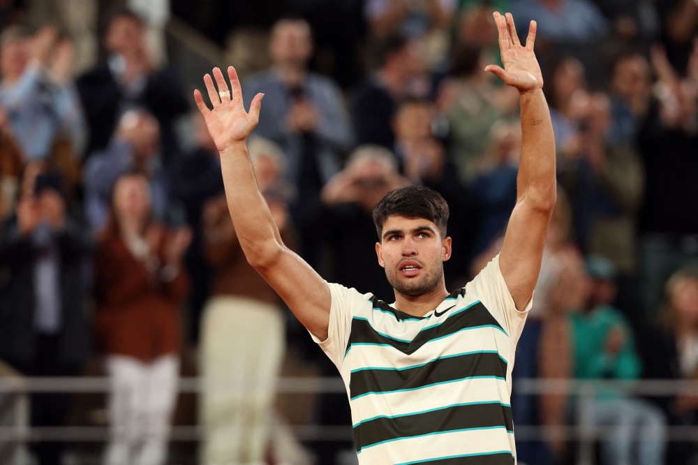 Spain’s Carlos Alcaraz celebrates his victory over US Tommy Paul during their quarter-final men’s singles match on day 10 of the French Open tennis tournament on Court Philippe-Chatrier at the Roland-Garros Complex in Paris on June 3, 2025. — AFP pic