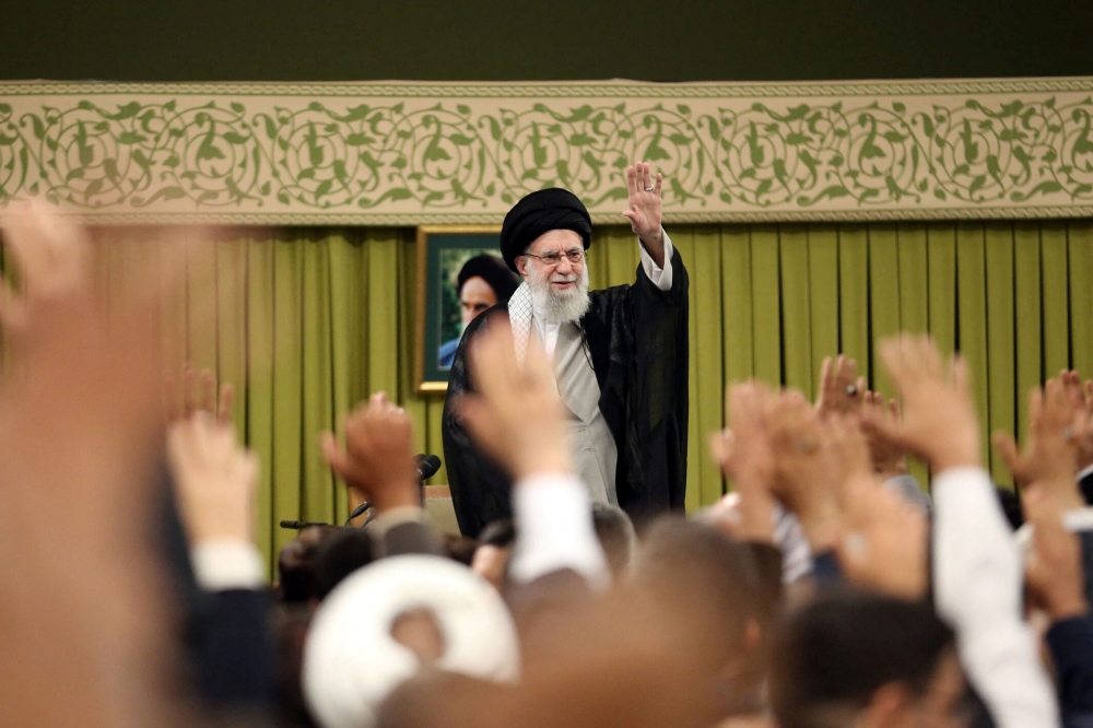 Iran’s Supreme Leader Ayatollah Ali Khamenei waves during a meeting with a group of teachers in Tehran May 17, 2025. Khamenei said on Wednesday a US proposal for a nuclear deal was against Tehran’s national interests, and that the country would not abandon uranium enrichment. — Reuters pic