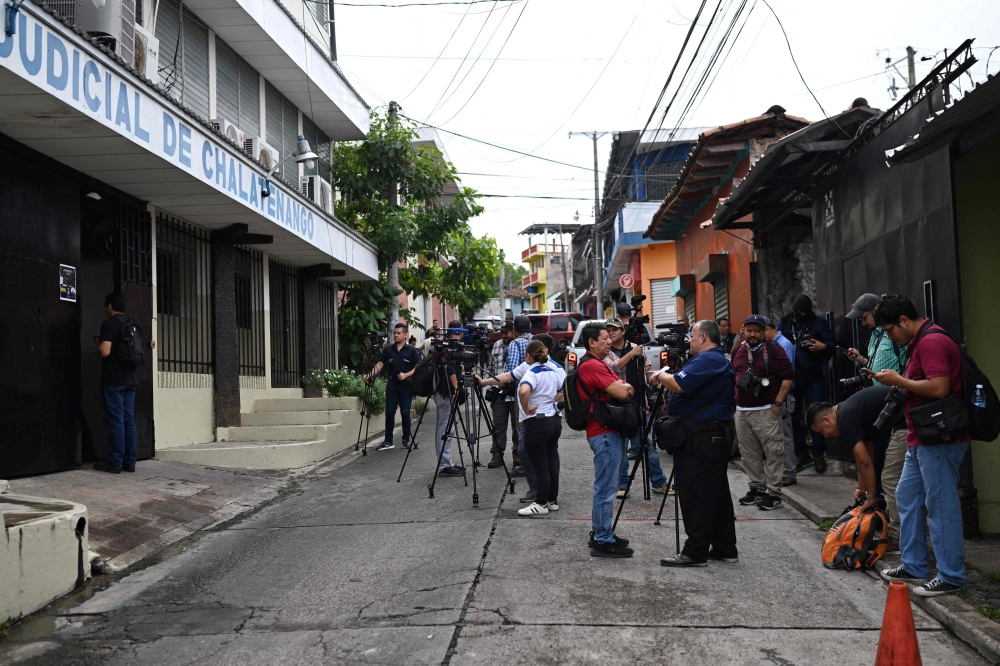 Journalists wait at the entrance to the Chalatenango Judicial Center, where a public hearing is being held against three high military commanders accused of ordering the murder of four Dutch journalists during El Salvador’s civil war (1979-1992) in Chalatenango, El Salvador on June 3, 2025. — AFP pic 