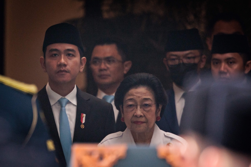 Indonesia’s Vice President Gibran Rakabuming Raka (left) and Indonesia’s former President Megawati Soekarnoputri (centre) attend the commemoration of Pancasila Day at the Pancasila Building, a historic hall within the Ministry of Foreign Affairs compound in Jakarta, on June 2, 2025. — AFP pic 