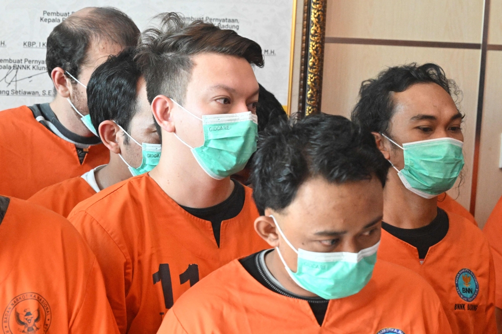 William Wallace Molyneaux (centre, left) of the US attends a press conference at the National Narcotics Agency Province of Bali, after being arrested on drug related crimes in Denpasar, on Indonesia resort island of Bali on June 5, 2025. — AFP pic 