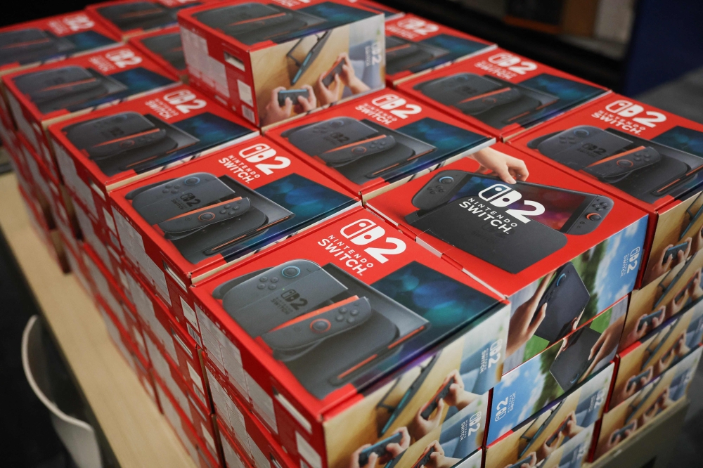 Nintendo's Switch 2 consoles in boxes are shown at a midnight opening of a Best Buy store yesterday in Florida. The Japanese gaming company is releasing the new console eight years after the original version became available. — AFP