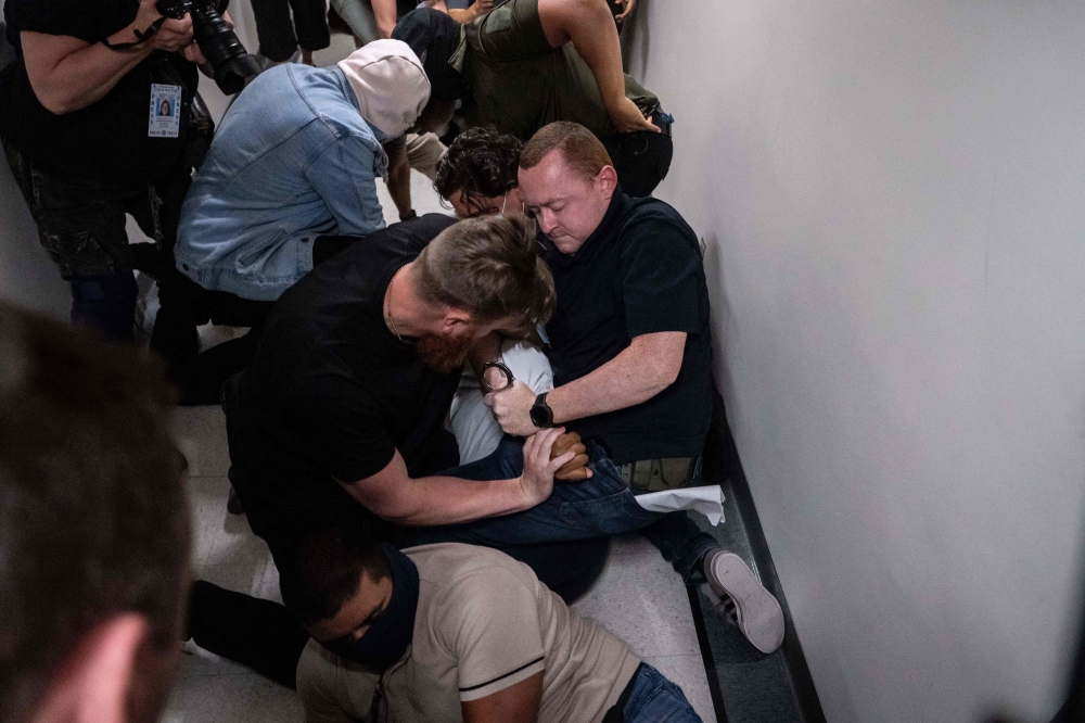 Federal agents are arresting immigrants outside of immigration court hearings, as ICE ramps up enforcement. — AFP pic