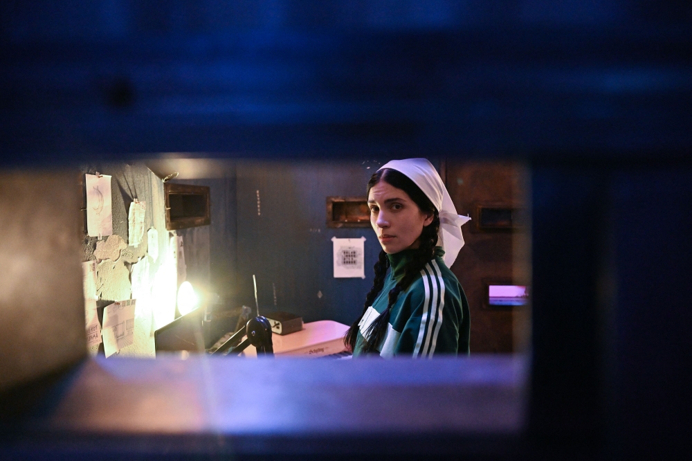 Russian artist Nadya Tolokonnikova, co-founder of Pussy Riot, can be seen inside her mock prison cell during her 10-day durational piece entitled 