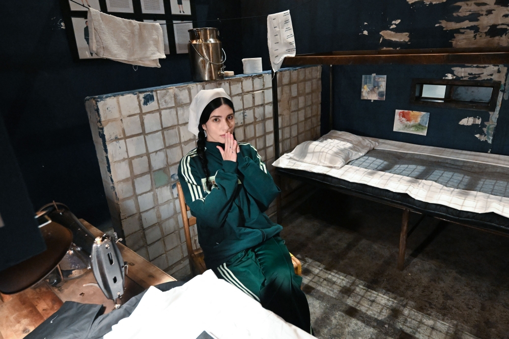 Artist Nadya Tolokonnikova, co-founder of Pussy Riot, poses inside a mock prison cell, part of her 10-day durational piece Police State at the Museum of Contemporary Art (MOCA) in Los Angeles June 6, 2025. — AFP pic
