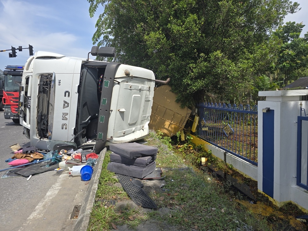 The tanker that crashed at Jalan Setia Raja roadside in Kuching. — Picture courtesy of Fire and Rescue Department 