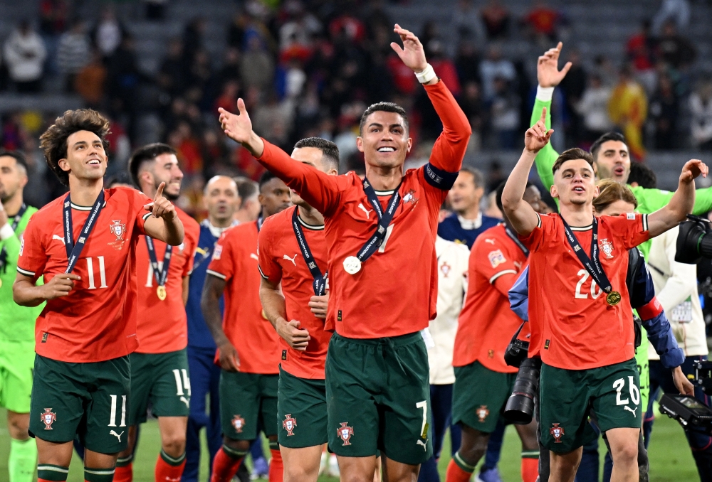 Portugal’s Cristiano Ronaldo, Francisco Conceicao and Joao Felix celebrate with fans after winning the UEFA Nations League final against Spain at the Allianz Arena in Munich, Germany June 8, 2025. — Reuters pic