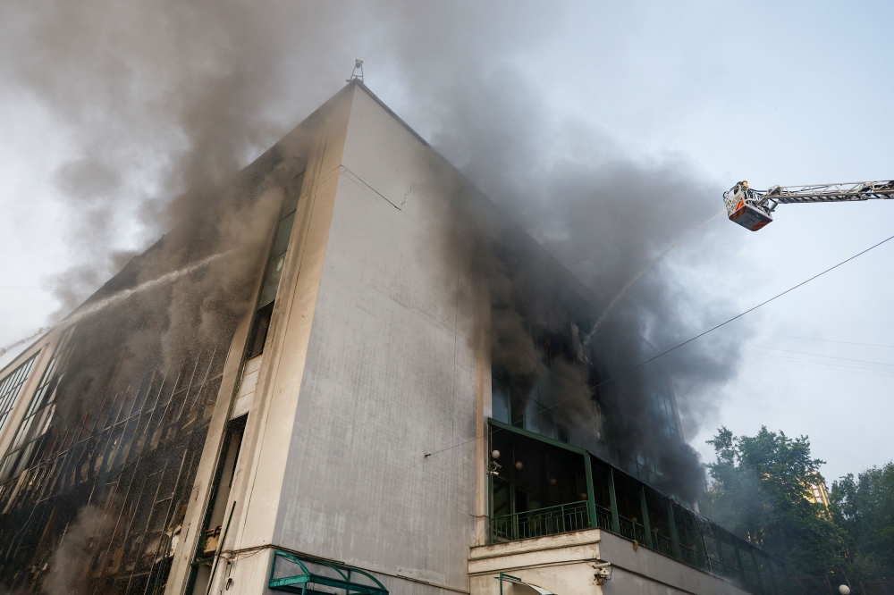 A firefighter works at the site of a Russian drone strike, amid Russia’s attack on Ukraine, in Kyiv, Ukraine June 10, 2025. — Reuters pic 