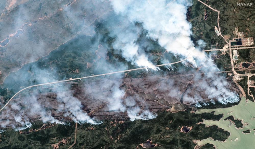 A satellite image shows an overview smoke rising from the York Factory First Nation wildfire, in Manitoba, Canada, May 30, 2025. — Maxar Technologies handout pic via Reuters 