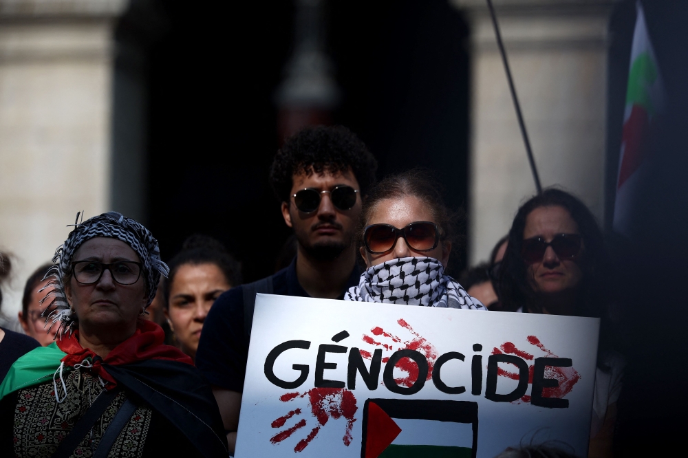 Participants gather during a rally to show their support for activists aboard a boat stopped by Israeli forces enroute to deliver aid to Gaza, during a rally in Lyon, south-eastern France on June 9, 2025. An independent United Nations commission said on Tuesday Israeli attacks on schools, religious and cultural sites in Gaza amount to war crimes and the crime against humanity of seeking to exterminate Palestinians. — AFP pic 