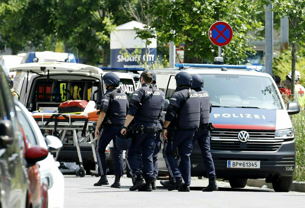 Policemen are seen in a street close to a school where, according to reports, several people died in a shooting, in Graz, southeastern Austria June 10, 2025. — AFP pic