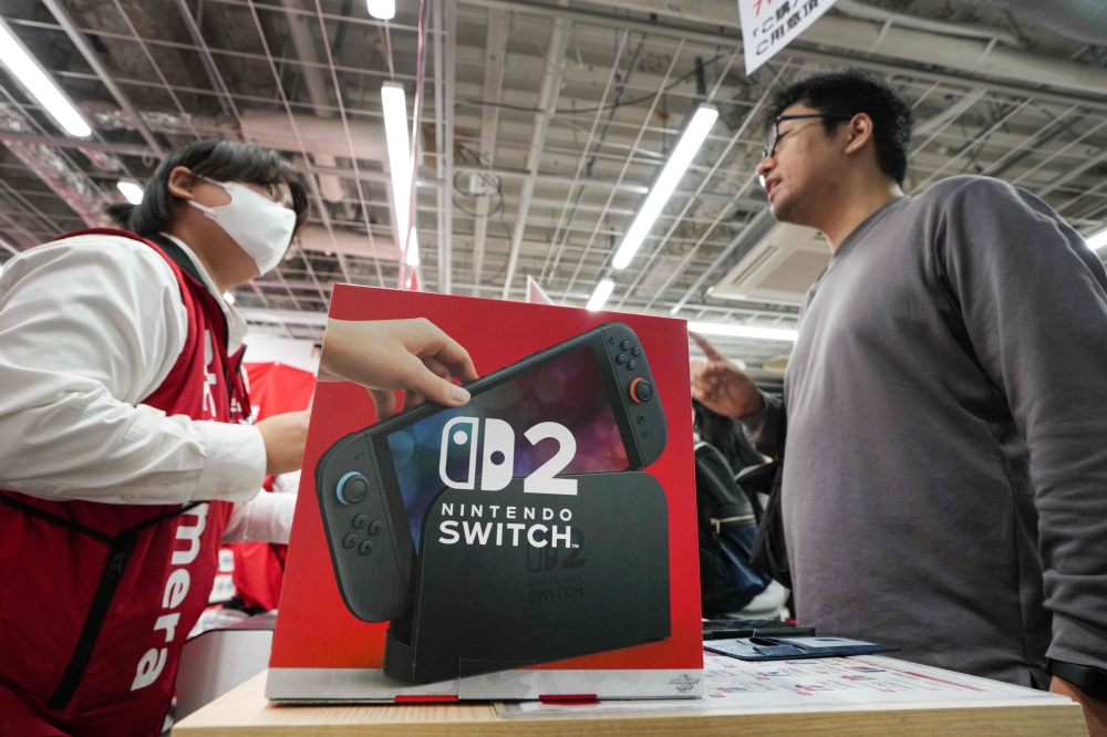 A customers purchases Nintendo Switch 2 at an electronics retailer in Tokyo June 5, 2025. — AFP pic