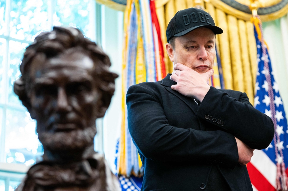 Elon Musk looks on during a news conference with US President Donald Trump in the Oval Office of the White House in Washington on May 30. — AFP pic