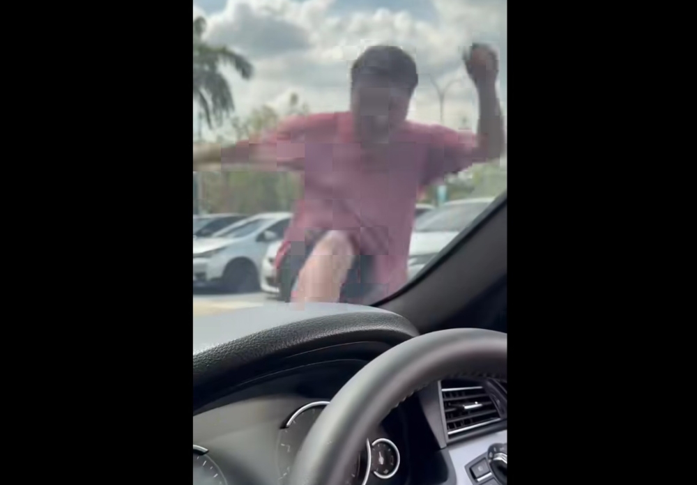 Singaporean Cheng Kuan Poh, 40, was arrested on June 8, a day after allegedly kicking and damaging a Malaysian couple’s car in a road altercation in Skudai’s Tun Aminah area. — Screengrab from Facebook/Vicky Sing