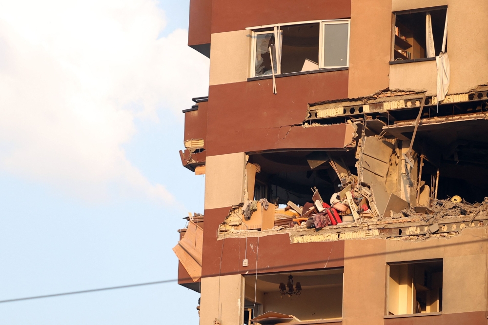 A picture taken shows a partial view of a destroyed apartment in a building targeted by an Israeli strike on the Iranian capital Tehran early in the morning. — AFP pic