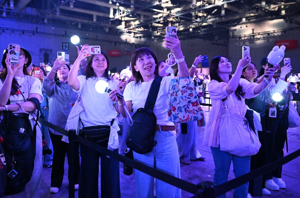 Fans of K-pop boy band BTS attend the annual ‘BTS Festa’ celebrating the group’s debut anniversary at Kintex exhibition centre in Goyang June 13, 2025. — AFP pic