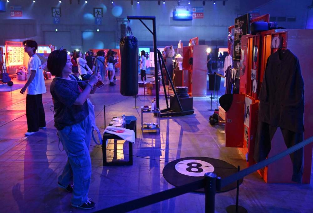 Fans of K-pop boy band BTS look around an exhibition booth during the annual ‘BTS Festa’ celebrating the group’s debut anniversary at Kintex exhibition centre in Goyang June 13, 2025. — AFP pic