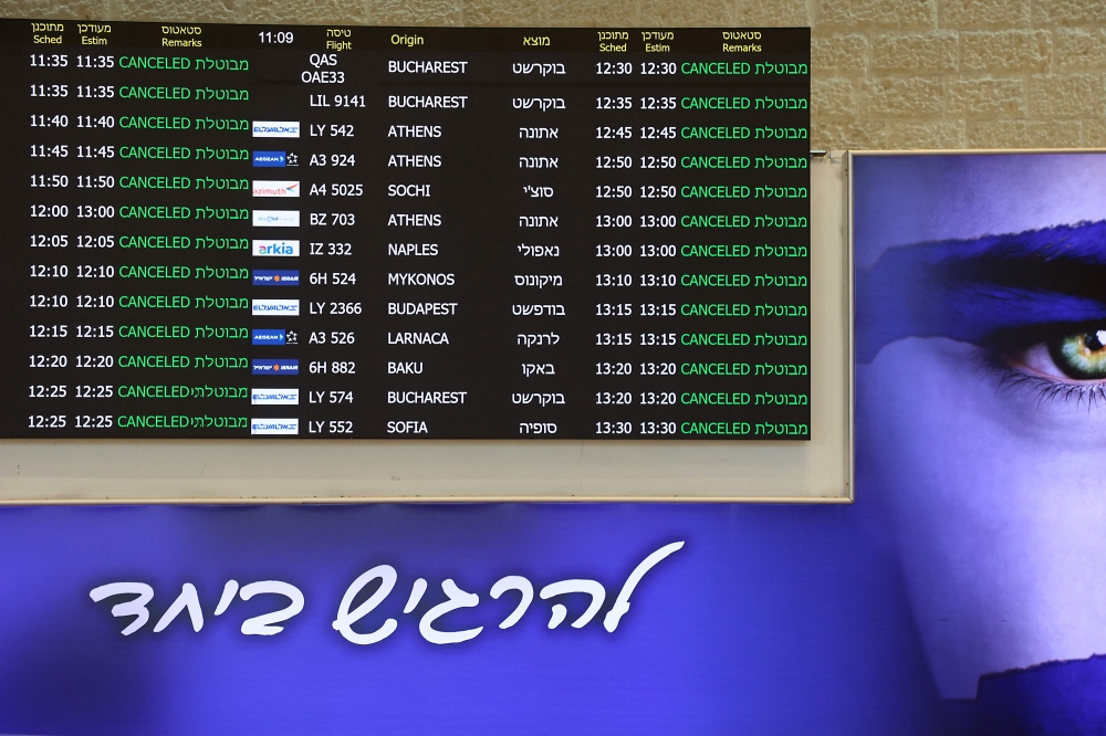 A board showing cancelled flights stands at arrivals hall at Ben Gurion Airport near Tel Aviv on June 13, 2025 after Israel closed its air space to takeoff and landing. — AFP pic