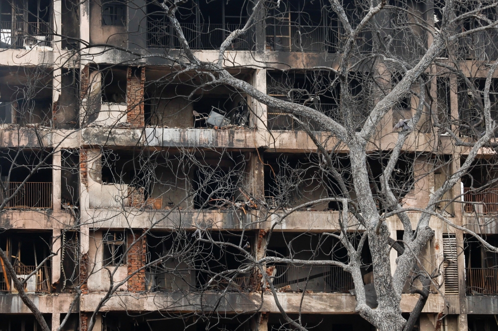 A view shows a damaged building at the crash site of Air India Boeing 787-8 Dreamliner plane, that crashed during take-off from an airport, in Ahmedabad, India, June 13, 2025. — Reuters pic